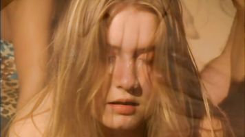 Sugar Babe and her friend Sophie Evans are together in this scene where the blonde is asked to strip naked by an unseen man.